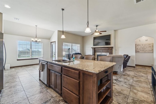 3730 Ruby Rdg, Piedmont, OK 73078 - kitchen featuring stainless steel appliances, ceiling fan, open shelves, a fireplace, and dark brown cabinets