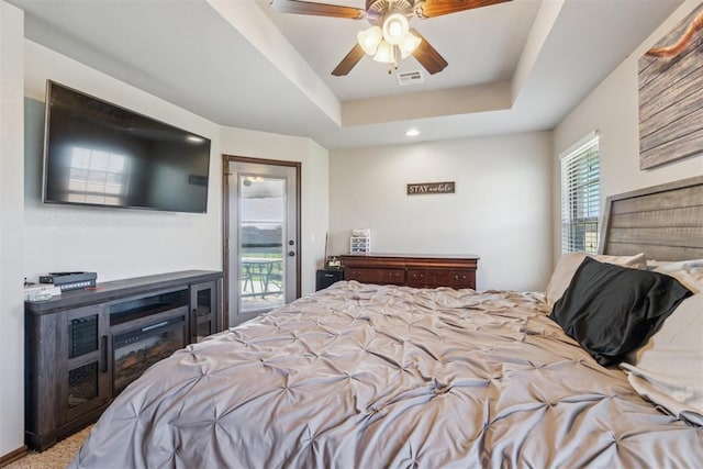 3730 Ruby Rdg, Piedmont, OK 73078 - bedroom with access to exterior, a raised ceiling, a ceiling fan, and recessed lighting