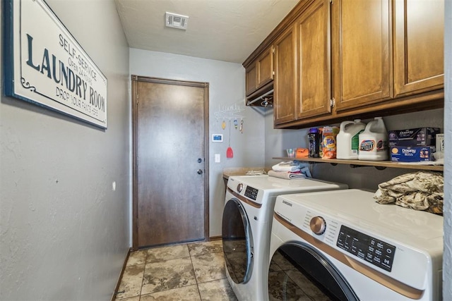 3730 Ruby Rdg, Piedmont, OK 73078 - washroom with washer and clothes dryer, cabinet space, and stone finish floors