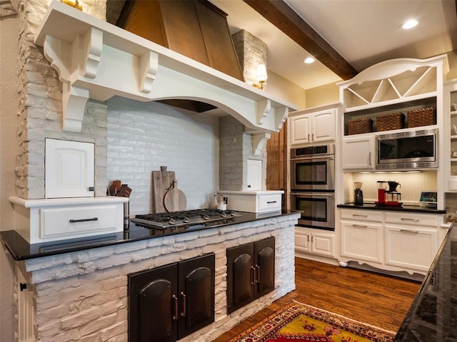 3325 Winding Creek Cir, Edmond, OK 73034 - kitchen featuring appliances with stainless steel finishes, decorative backsplash, dark wood finished floors, dark countertops, and beam ceiling