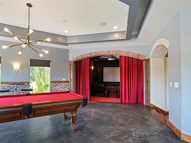 3325 Winding Creek Cir, Edmond, OK 73034 - recreation room with arched walkways, a chandelier, billiards, and a raised ceiling