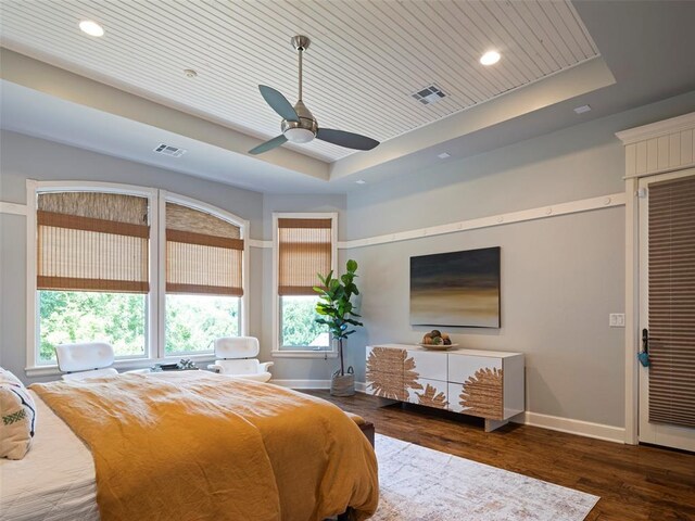 3325 Winding Creek Cir, Edmond, OK 73034 - bedroom featuring a raised ceiling, multiple windows, wood finished floors, recessed lighting, and wooden ceiling