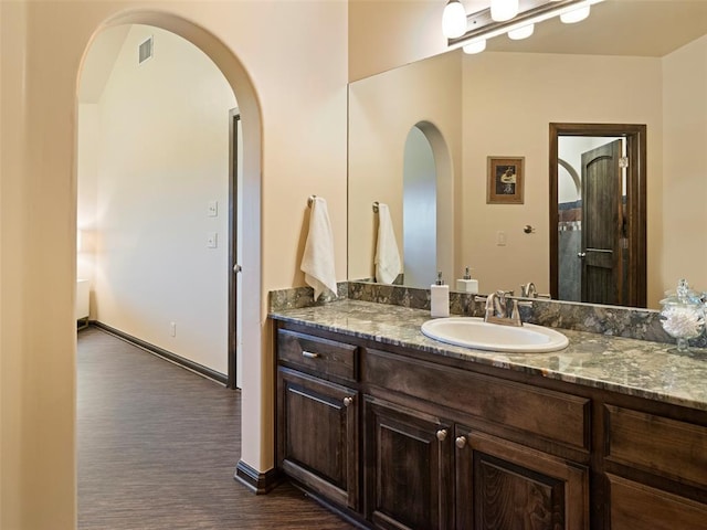 3325 Winding Creek Cir, Edmond, OK 73034 - bathroom featuring vanity and wood finished floors