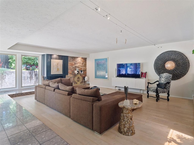 7501 Brookside Dr, Oklahoma City, OK 73132 - living room featuring a textured ceiling and light wood-style flooring