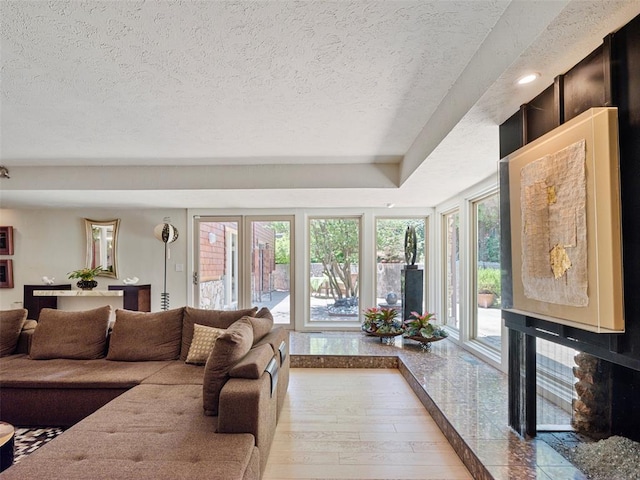 7501 Brookside Dr, Oklahoma City, OK 73132 - living room featuring a textured ceiling and wood finished floors