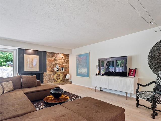 7501 Brookside Dr, Oklahoma City, OK 73132 - living room with a textured ceiling and wood finished floors