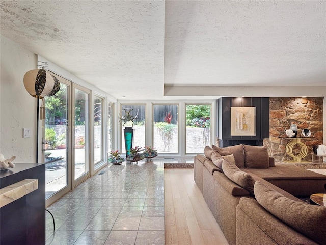 7501 Brookside Dr, Oklahoma City, OK 73132 - living room featuring a textured ceiling and wood finished floors