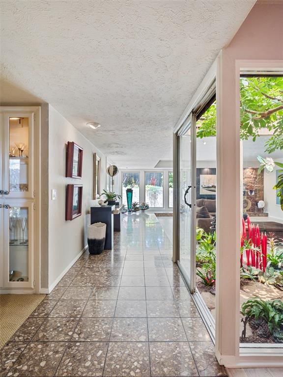 7501 Brookside Dr, Oklahoma City, OK 73132 - hallway with a textured ceiling