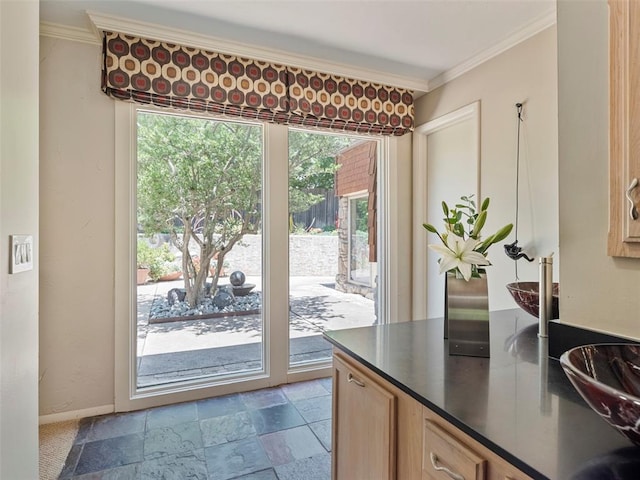 7501 Brookside Dr, Oklahoma City, OK 73132 - doorway featuring ornamental molding and stone tile flooring