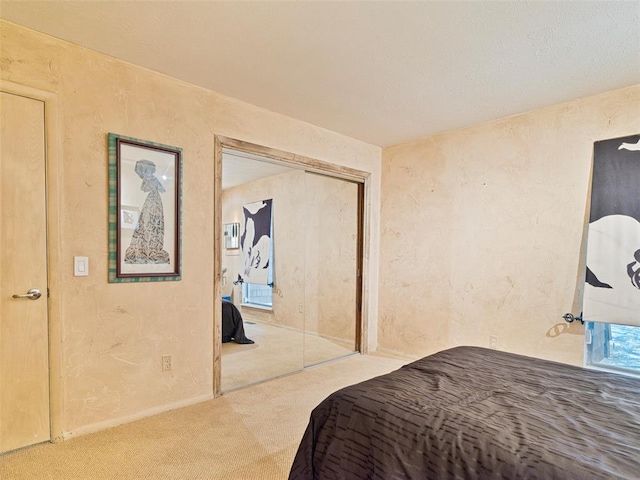7501 Brookside Dr, Oklahoma City, OK 73132 - carpeted bedroom featuring a closet and a textured wall