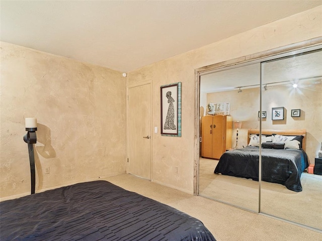 7501 Brookside Dr, Oklahoma City, OK 73132 - carpeted bedroom featuring a closet and a textured wall