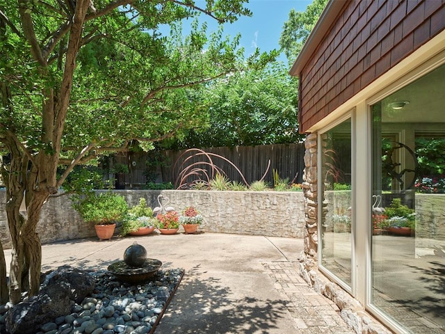 7501 Brookside Dr, Oklahoma City, OK 73132 - fenced backyard featuring a patio