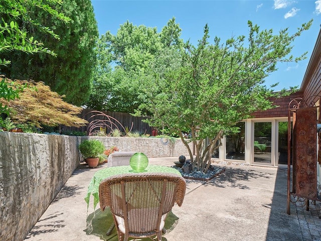 7501 Brookside Dr, Oklahoma City, OK 73132 - fenced backyard with a patio area