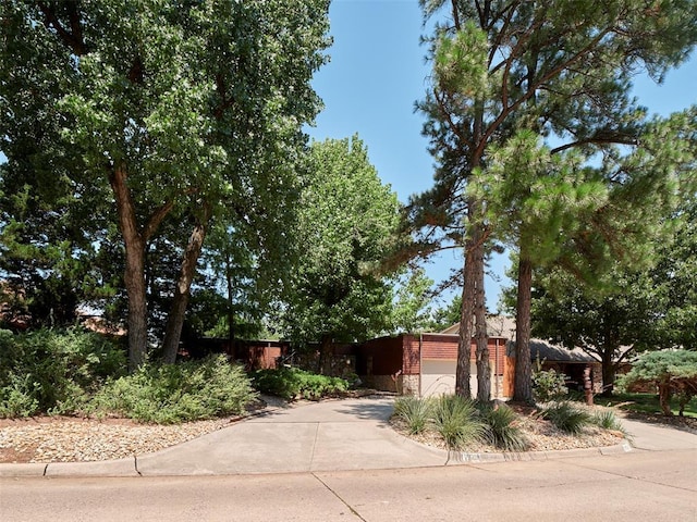 7501 Brookside Dr, Oklahoma City, OK 73132 - view of front facade featuring driveway and a garage