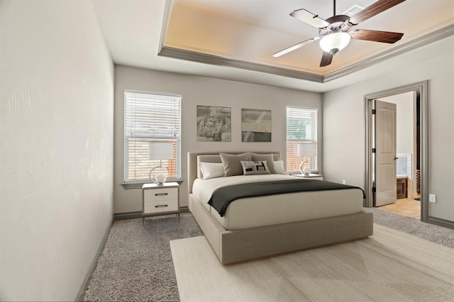 2828 Ryder Dr, Yukon, OK 73099 - bedroom with carpet flooring, a raised ceiling, ensuite bathroom, and a ceiling fan