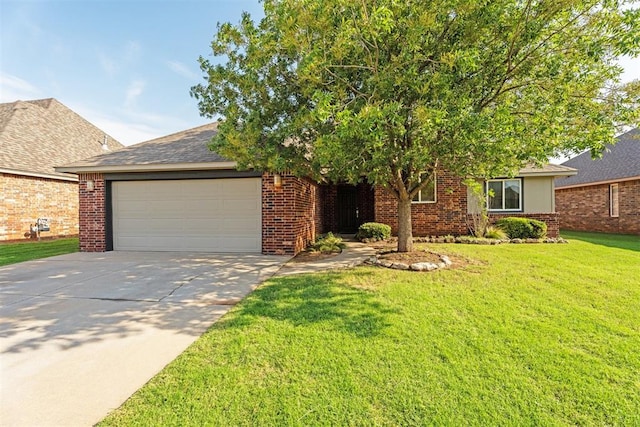 2429 NW 176th St, Edmond, OK 73012 - obstructed view of property with driveway, a garage, a front yard, and brick siding