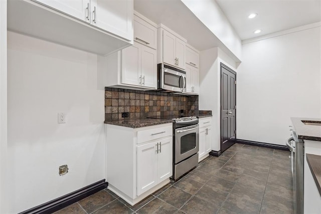 2429 NW 176th St, Edmond, OK 73012 - kitchen with appliances with stainless steel finishes, decorative backsplash, white cabinetry, recessed lighting, and dark stone counters