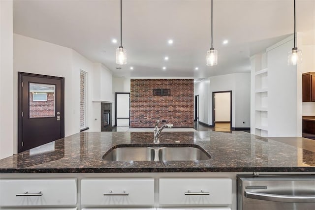 2429 NW 176th St, Edmond, OK 73012 - kitchen with stainless steel dishwasher, open floor plan, dark stone counters, and recessed lighting