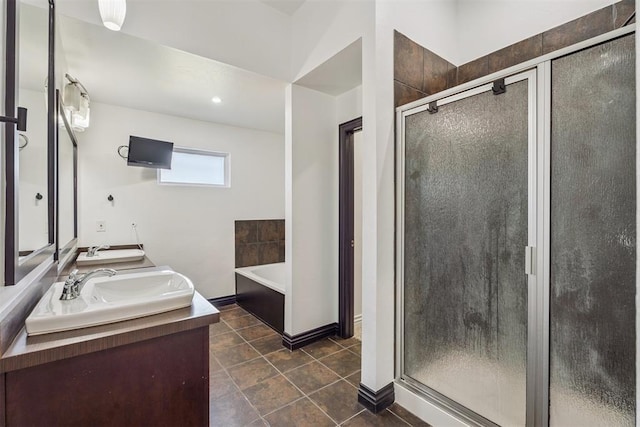 2429 NW 176th St, Edmond, OK 73012 - bathroom with a shower stall, double vanity, a garden tub, and tile patterned floors
