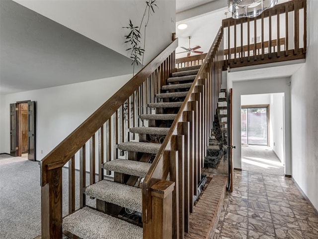 9220 Sutton Pl, Oklahoma City, OK 73132 - staircase featuring stone tile flooring, a high ceiling, and a ceiling fan