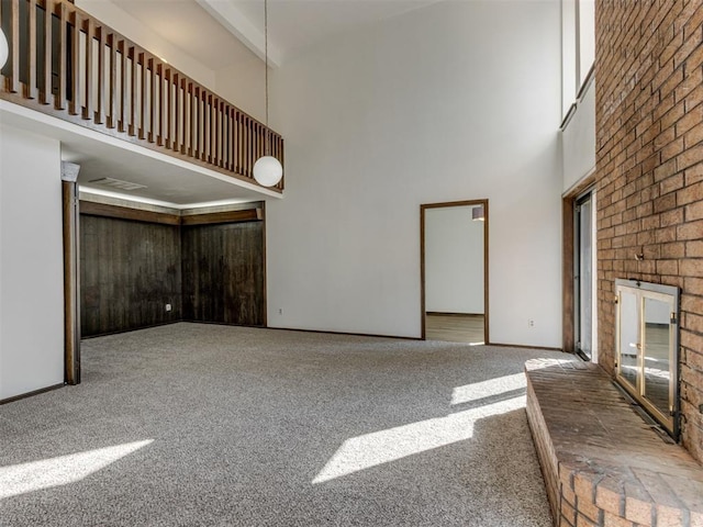 9220 Sutton Pl, Oklahoma City, OK 73132 - unfurnished living room with a towering ceiling and carpet
