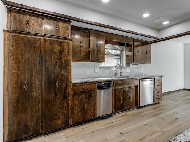 9220 Sutton Pl, Oklahoma City, OK 73132 - kitchen with stainless steel dishwasher, light wood finished floors, dark brown cabinets, and recessed lighting