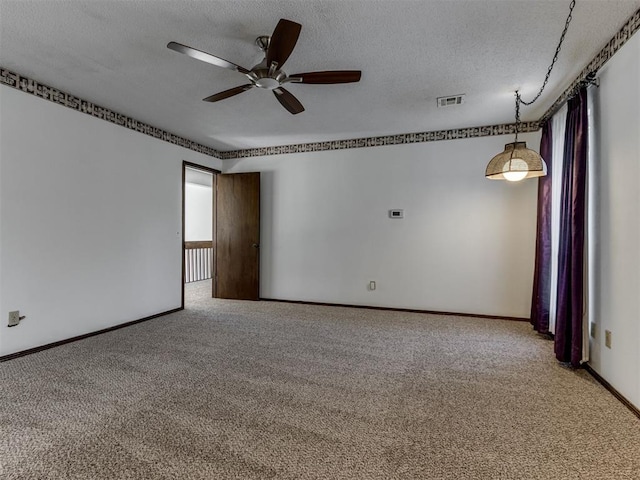 9220 Sutton Pl, Oklahoma City, OK 73132 - spare room featuring a ceiling fan, light carpet, and a textured ceiling