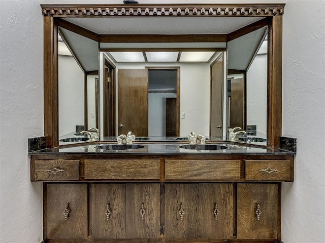 9220 Sutton Pl, Oklahoma City, OK 73132 - bathroom featuring a textured wall and double vanity