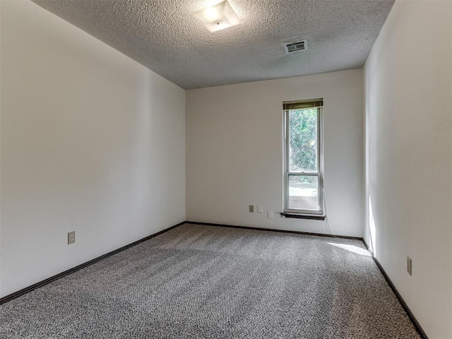 9220 Sutton Pl, Oklahoma City, OK 73132 - unfurnished room featuring a textured ceiling and carpet flooring