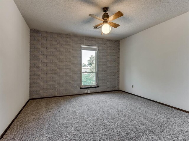 9220 Sutton Pl, Oklahoma City, OK 73132 - carpeted spare room featuring a ceiling fan and a textured ceiling