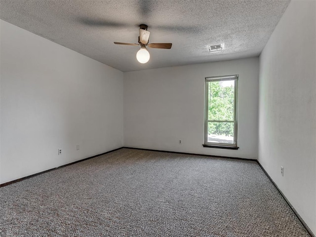 9220 Sutton Pl, Oklahoma City, OK 73132 - carpeted spare room featuring a ceiling fan and a textured ceiling