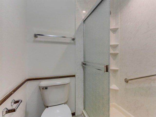 9220 Sutton Pl, Oklahoma City, OK 73132 - bathroom featuring a stall shower and toilet