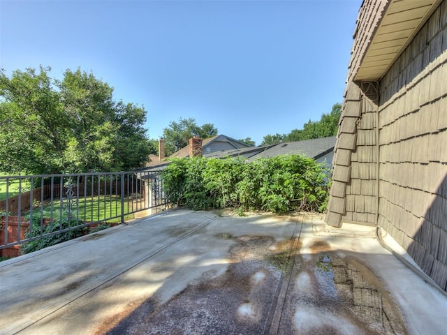 9220 Sutton Pl, Oklahoma City, OK 73132 - fenced backyard with a patio