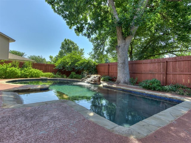 9220 Sutton Pl, Oklahoma City, OK 73132 - view of pool featuring a fenced backyard and a pool with connected hot tub