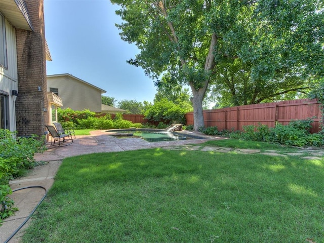 9220 Sutton Pl, Oklahoma City, OK 73132 - fenced backyard featuring a patio and a pool with connected hot tub