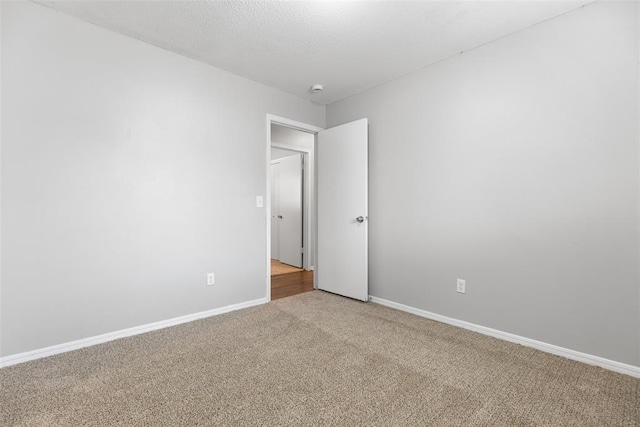 4101 NW 51st St, Oklahoma City, OK 73112 - carpeted empty room with baseboards and a smoke detector