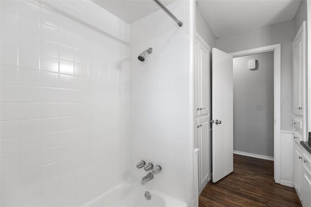4101 NW 51st St, Oklahoma City, OK 73112 - bathroom with shower / washtub combination and wood finished floors