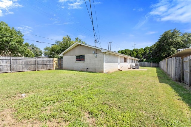 4101 NW 51st St, Oklahoma City, OK 73112 - rear view of property with brick siding and a fenced backyard