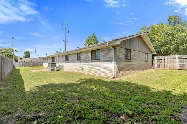 4101 NW 51st St, Oklahoma City, OK 73112 - back of house with brick siding and a fenced backyard