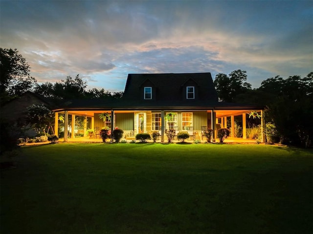 1301 E Rock Creek Rd, Tuttle, OK 73089 - rear view of house with a yard, board and batten siding, and a porch