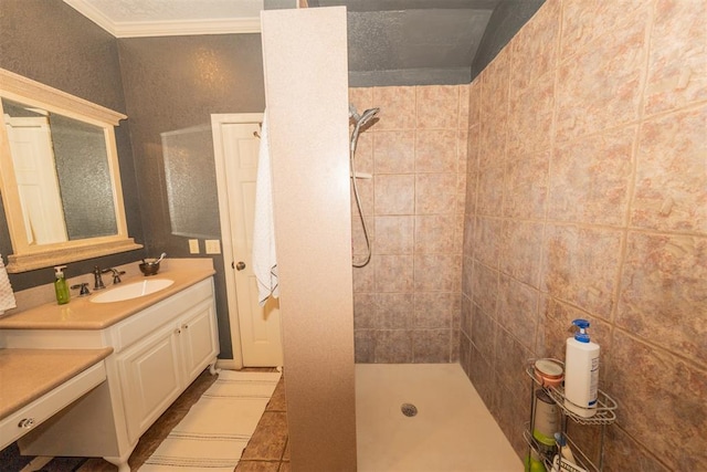 1301 E Rock Creek Rd, Tuttle, OK 73089 - full bathroom featuring a tile shower, vanity, crown molding, and tile patterned flooring