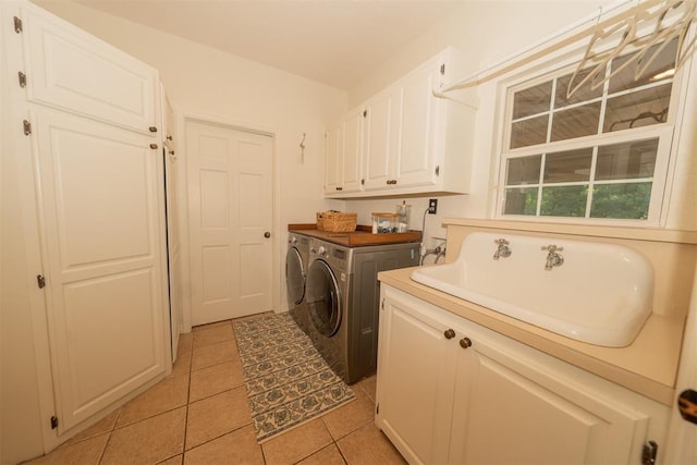 1301 E Rock Creek Rd, Tuttle, OK 73089 - washroom with separate washer and dryer, cabinet space, and light tile patterned floors
