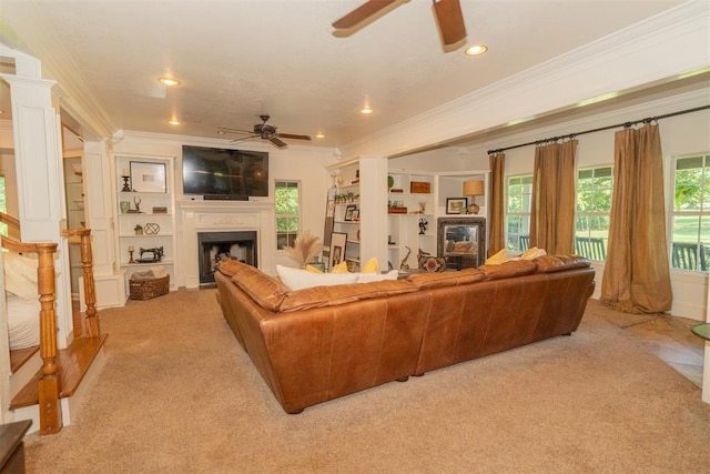 1301 E Rock Creek Rd, Tuttle, OK 73089 - living room with ceiling fan, a fireplace, ornamental molding, light colored carpet, and recessed lighting