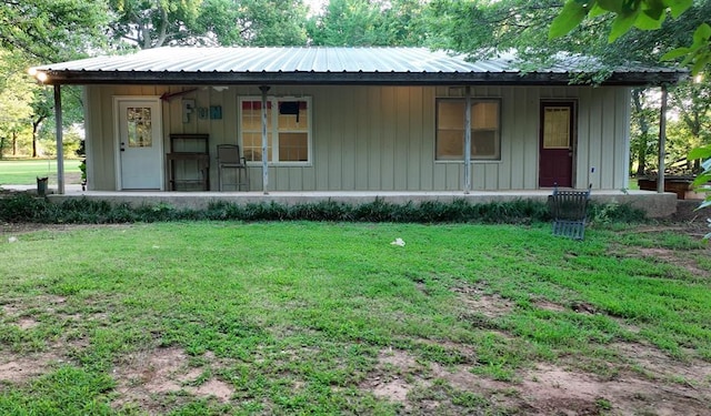 1301 E Rock Creek Rd, Tuttle, OK 73089 - view of front of house featuring a porch, a front yard, and a metal roof