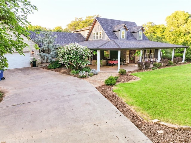 1301 E Rock Creek Rd, Tuttle, OK 73089 - view of front of house featuring covered porch, a front yard, concrete driveway, and roof with shingles