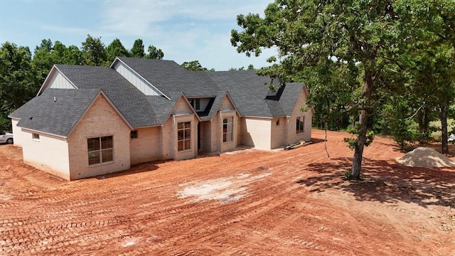 8121 Red Feather, Arcadia, OK 73007 - view of front of property featuring roof with shingles and board and batten siding
