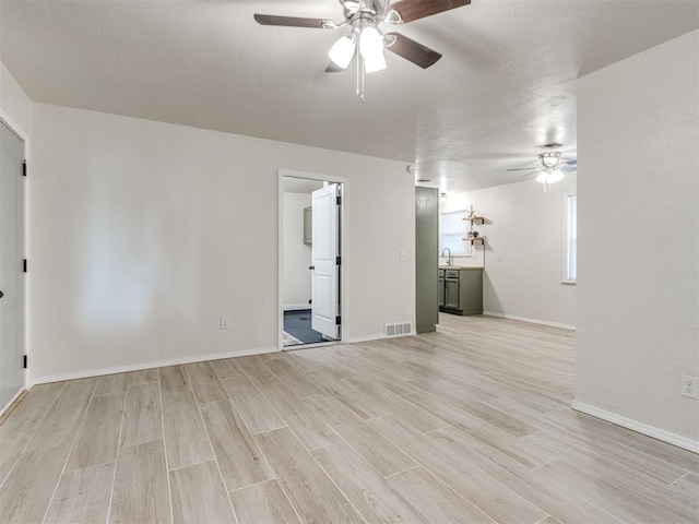 2753 SW 46th Pl, Oklahoma City, OK 73119 - empty room featuring a ceiling fan and light wood finished floors