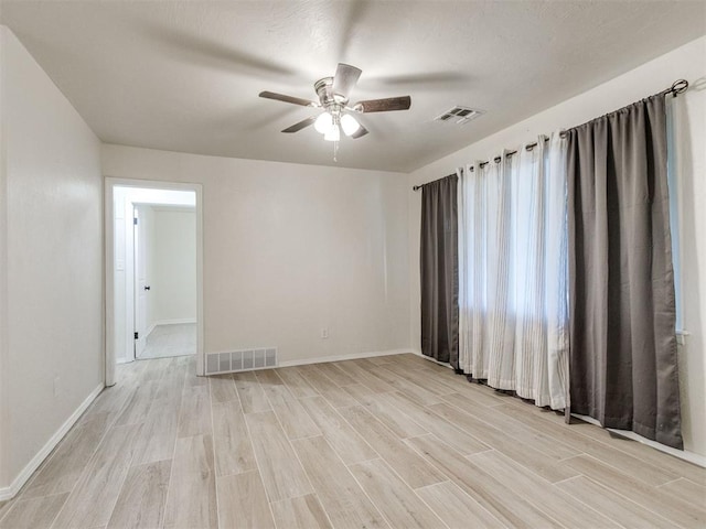 2753 SW 46th Pl, Oklahoma City, OK 73119 - unfurnished room with a ceiling fan and light wood-style flooring