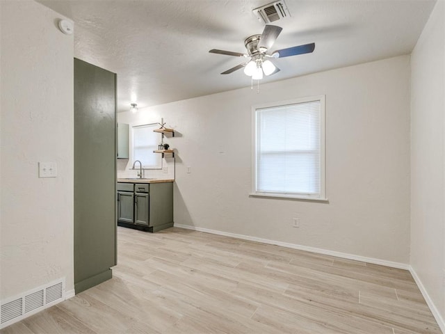 2753 SW 46th Pl, Oklahoma City, OK 73119 - empty room with a ceiling fan and light wood finished floors