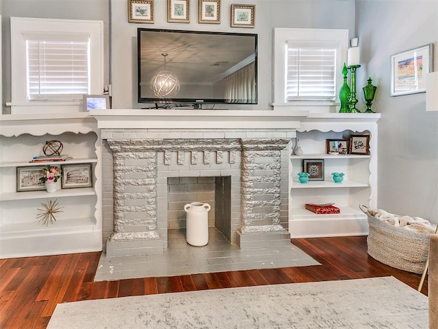 1122 NW 42nd St, Oklahoma City, OK 73118 - detailed view of wood finished floors and a brick fireplace